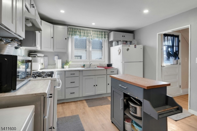 6 Madison Street Newton, NJ 07860 - Photo 13 of 28 a kitchen with a refrigerator stove and sink