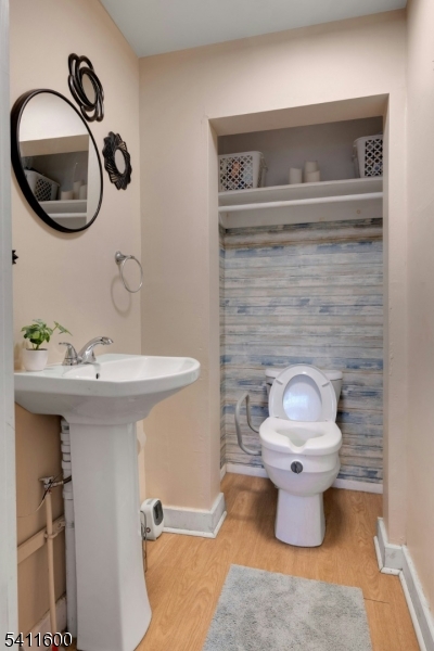 6 Madison Street Newton, NJ 07860 - Photo 19 of 28 a bathroom with a toilet sink and mirror