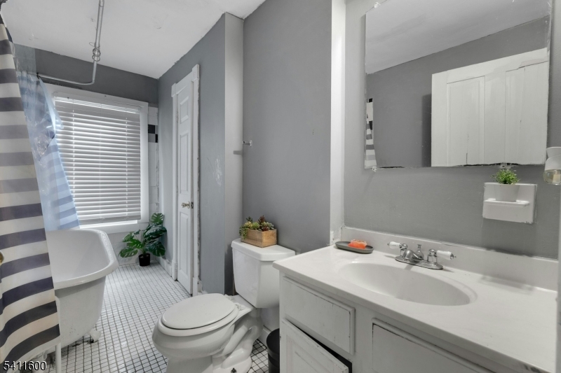 6 Madison Street Newton, NJ 07860 - Photo 22 of 28 a bathroom with a sink toilet and shower