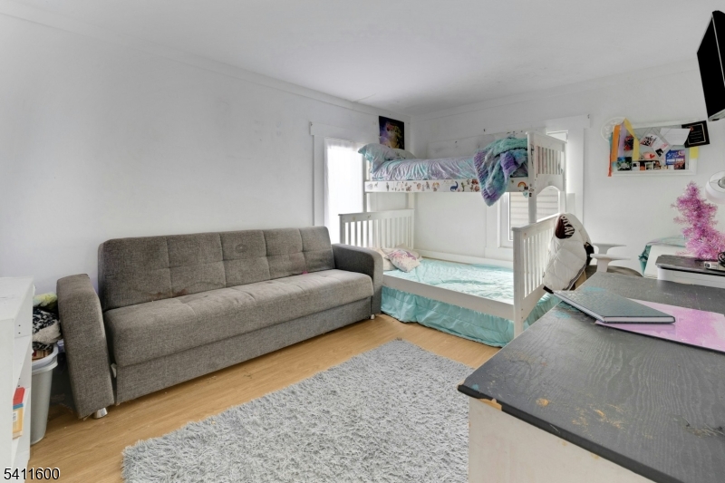 6 Madison Street Newton, NJ 07860 - Photo 25 of 28 a living room with furniture and a couch