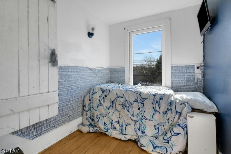 6 Madison Street Newton, NJ 07860 - Photo 27 of 28 a bedroom with a bed and a window