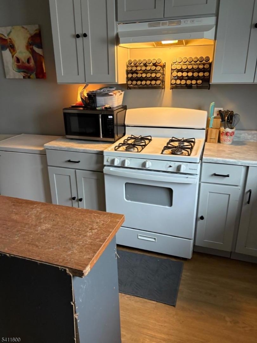 6 Madison Street Newton, NJ 07860 - Photo 4 of 28 a kitchen with stainless steel appliances granite countertop a stove a sink and a refrigerator