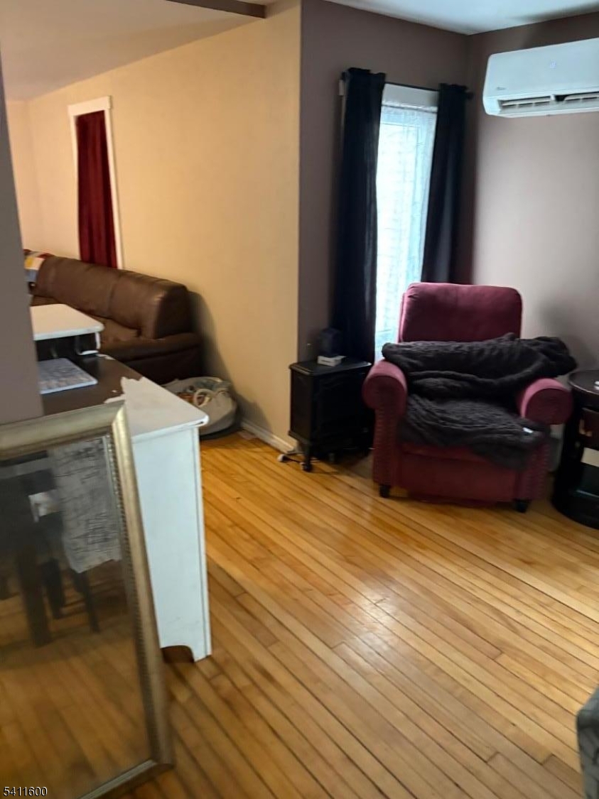6 Madison Street Newton, NJ 07860 - Photo 5 of 28 a living room with furniture and a mirror