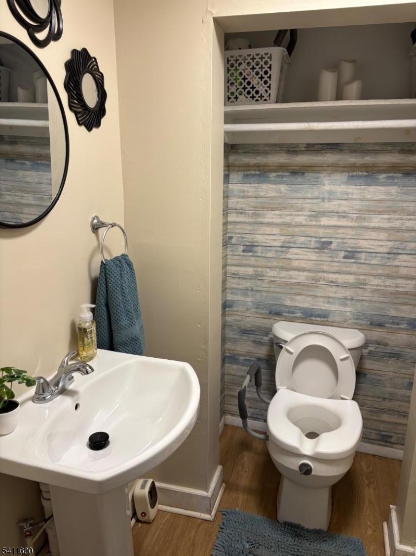 6 Madison Street Newton, NJ 07860 - Photo 6 of 28 a bathroom with a toilet sink and mirror