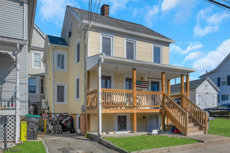 6 Madison Street Newton, NJ 07860 - Photo 8 of 28 a front view of a residential apartment building with a yard