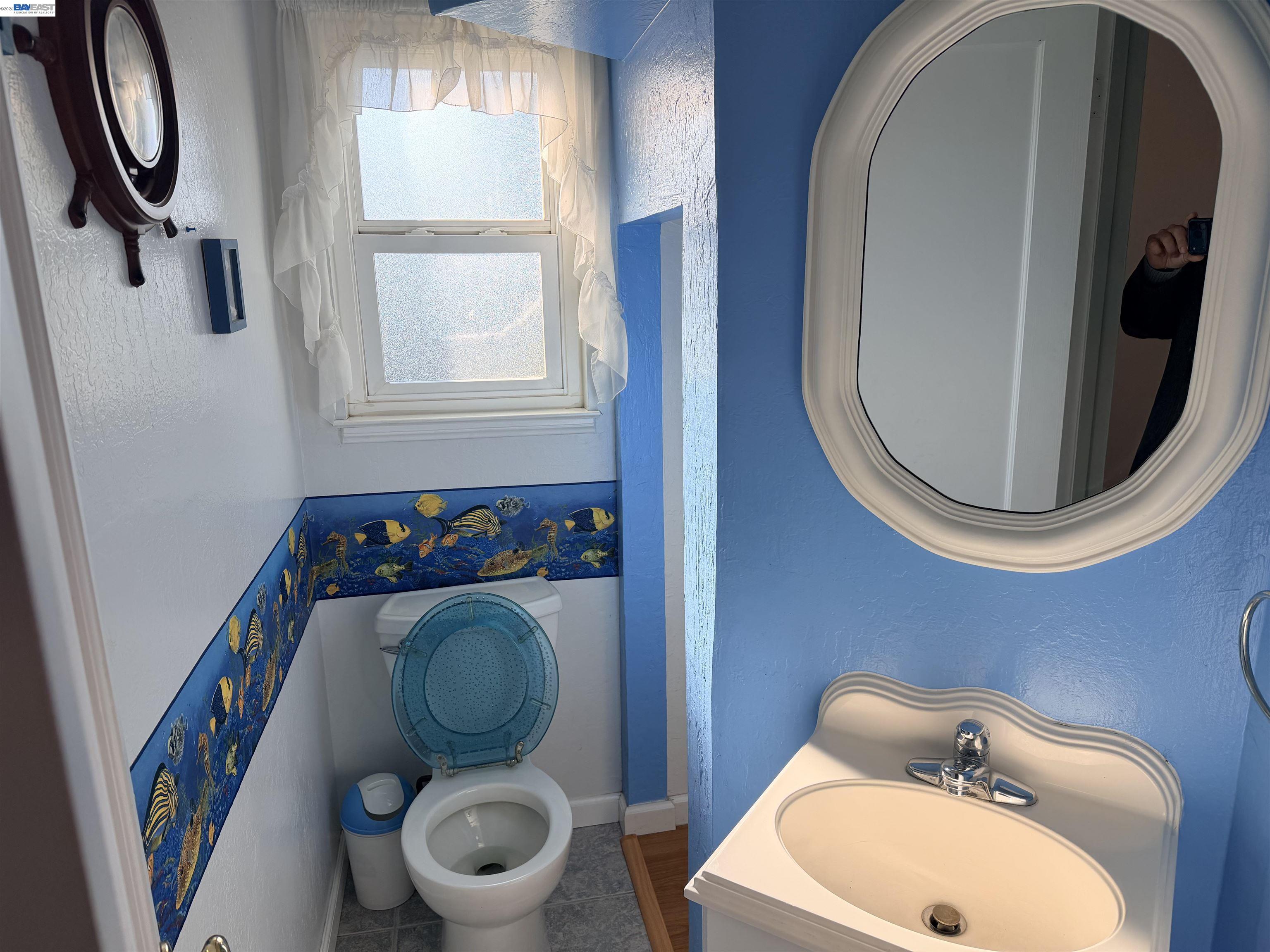 4526 Windsweep Road Bethel Island, CA 94511 - Photo 12 of 41 a bathroom with a toilet and a sink