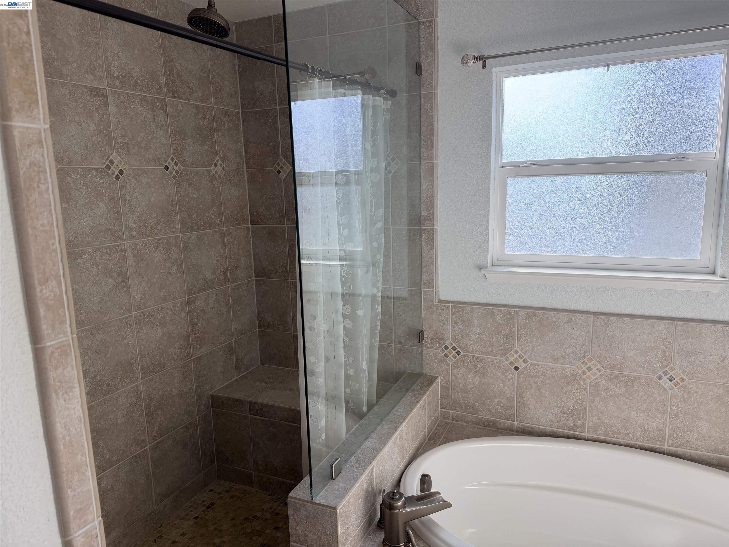 4526 Windsweep Road Bethel Island, CA 94511 - Photo 17 of 41 a bathroom with a bathtub and a shower