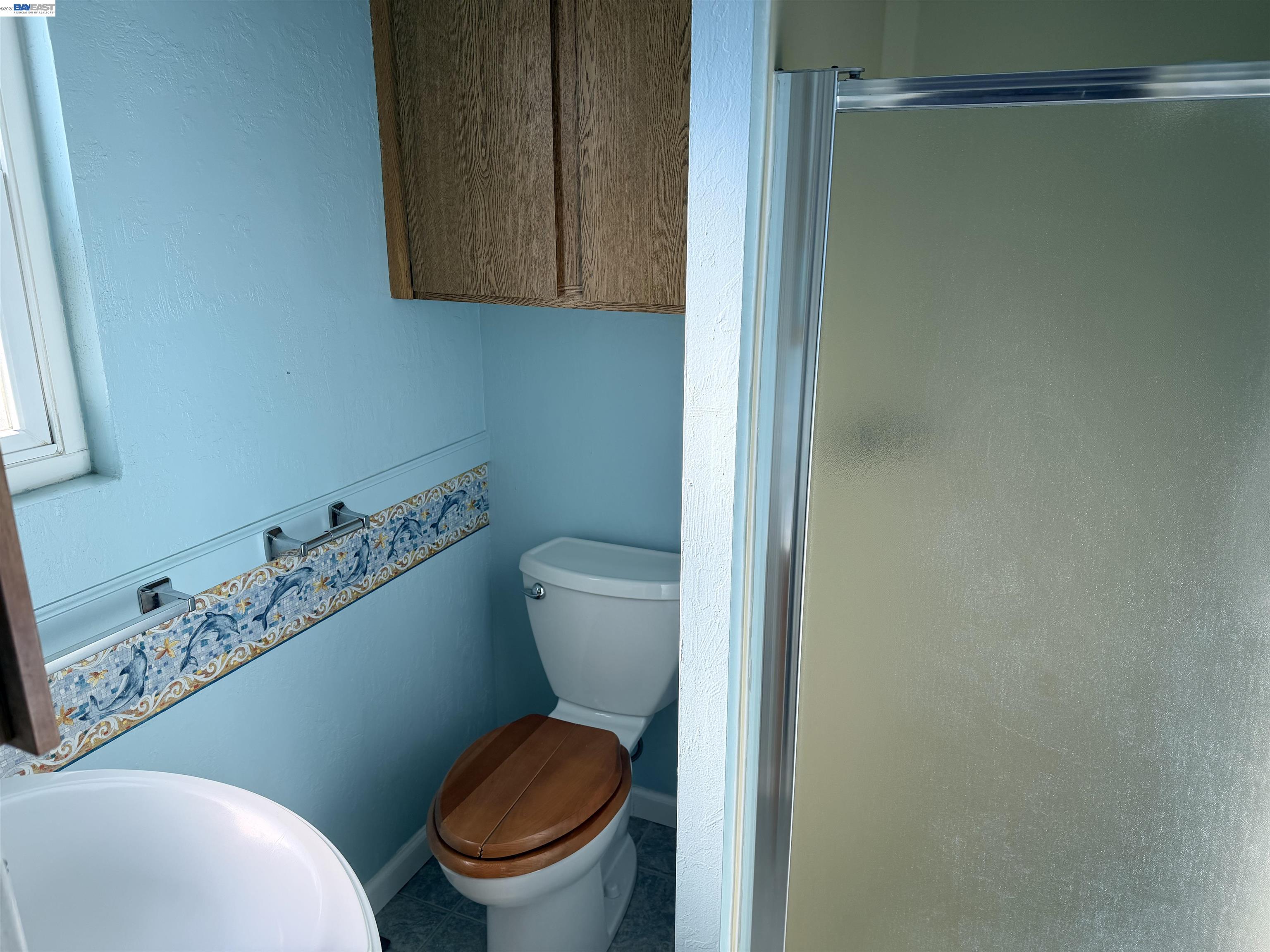 4526 Windsweep Road Bethel Island, CA 94511 - Photo 20 of 41 a white toilet sitting next to a bathroom sink