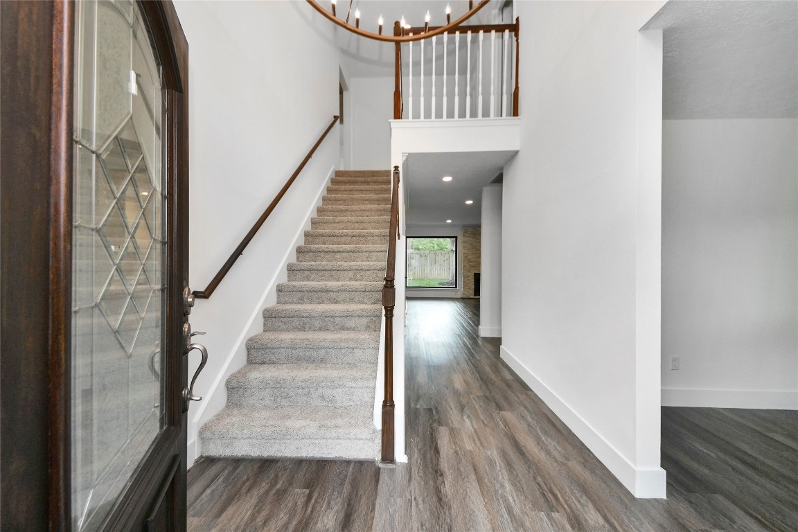 8510 Canyon Pine Drive Spring, TX 77379 - Photo 6 of 42 a view of staircase with wooden floor and white walls