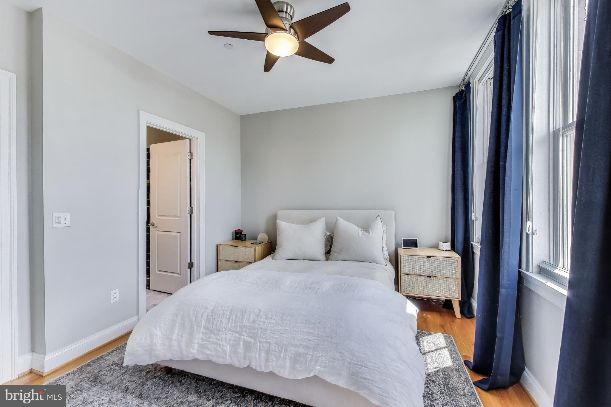 1406 T Street Northwest, Unit 6 Washington, DC 20009 - Photo 20 of 31 a bedroom with a bed and ceiling fan
