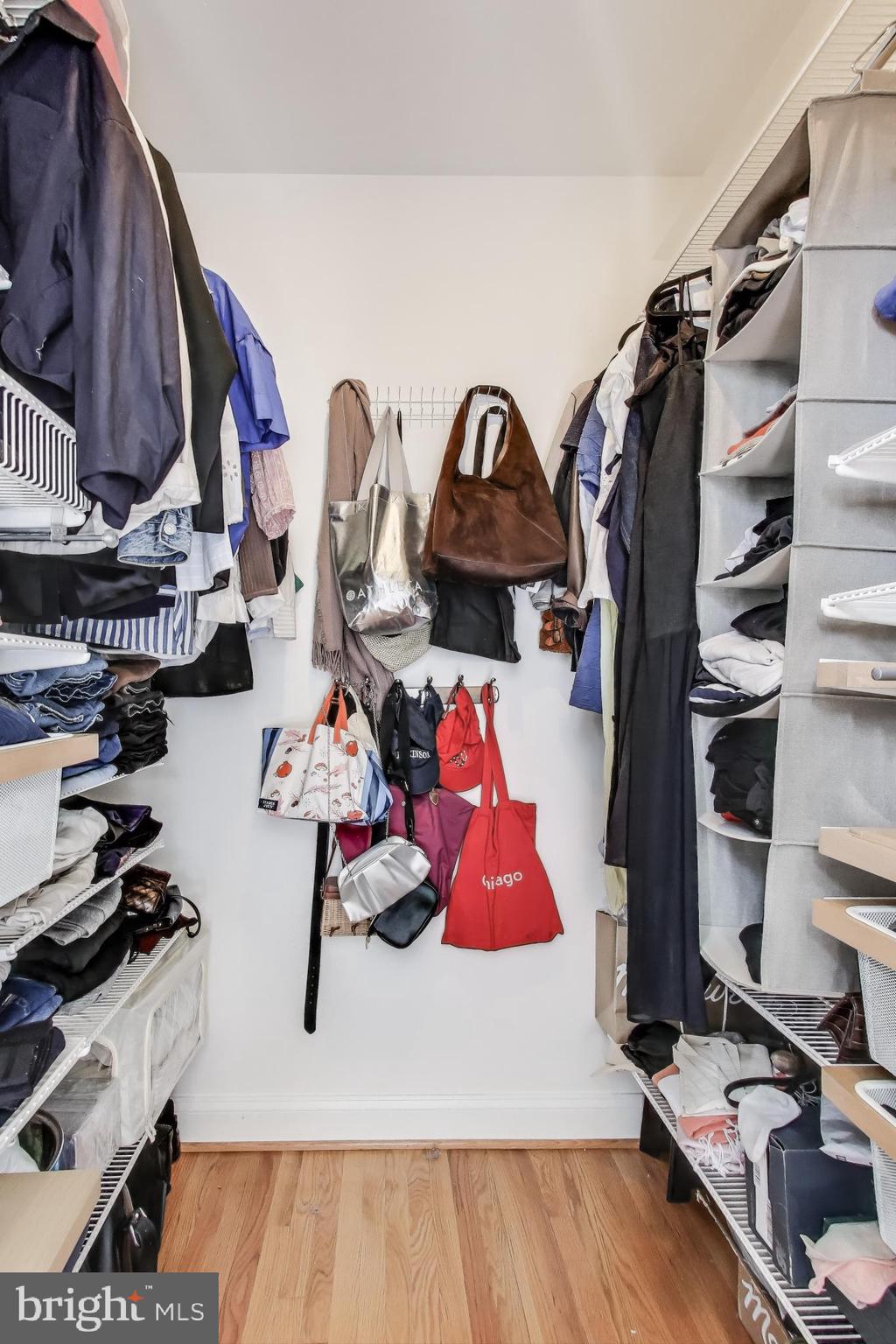1406 T Street Northwest, Unit 6 Washington, DC 20009 - Photo 23 of 31 a view of walk in closet with clothes and shoes
