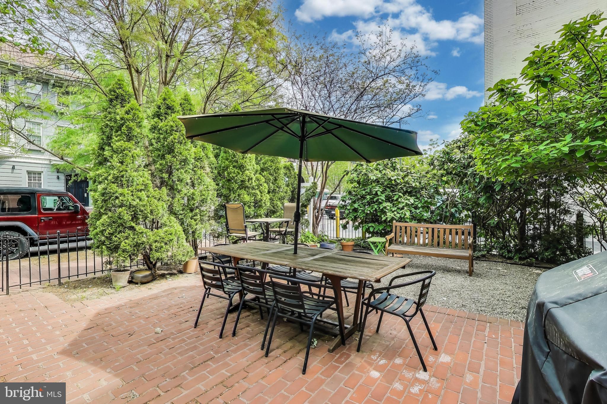 1406 T Street Northwest, Unit 6 Washington, DC 20009 - Photo 6 of 31 a view of an outdoor space with furniture and umbrella