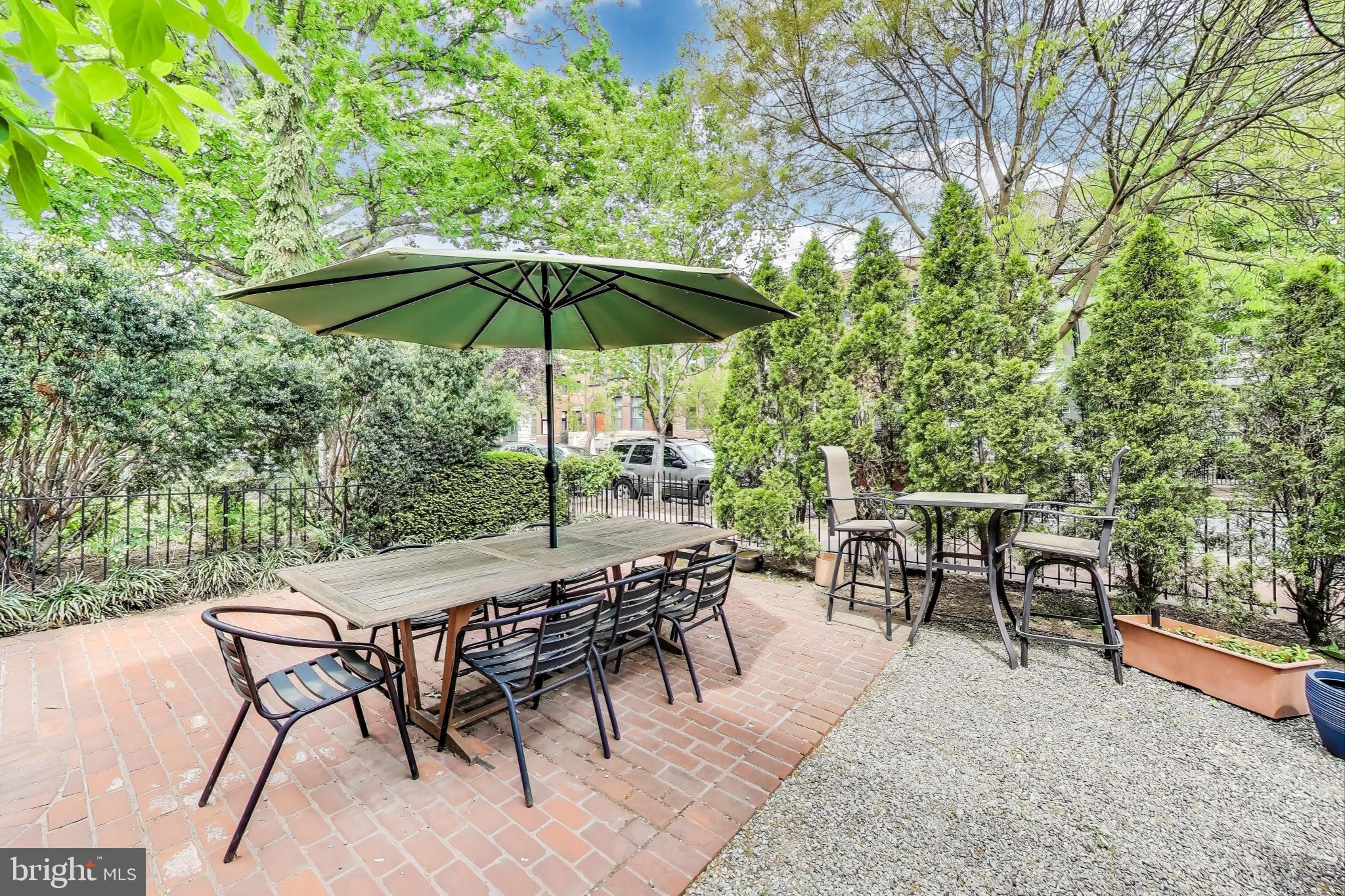 1406 T Street Northwest, Unit 6 Washington, DC 20009 - Photo 7 of 31 an outdoor space with furniture and umbrella