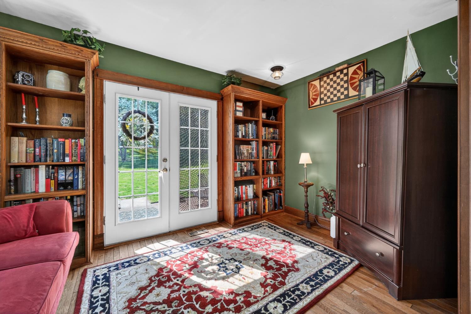2179 Webb Road Brookville, IN 47012 - Photo 15 of 84 Custom oak shelving surrounding the french doors give this room a true library feel!