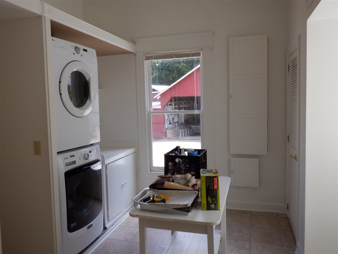 1516 Bahama Road Bahama, NC 27503 - Photo 10 of 25 Oversized laundry room with washer, dryer, built in ironing board & storage for iron, and closets & cubbies galore Laundry room