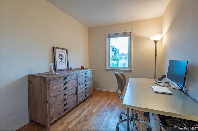 a bed room with furniture and a window