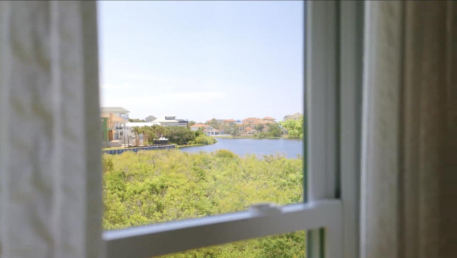 83 Sunfish Street Destin, FL 32541 - Photo 45 of 56 a view of a lake from a window