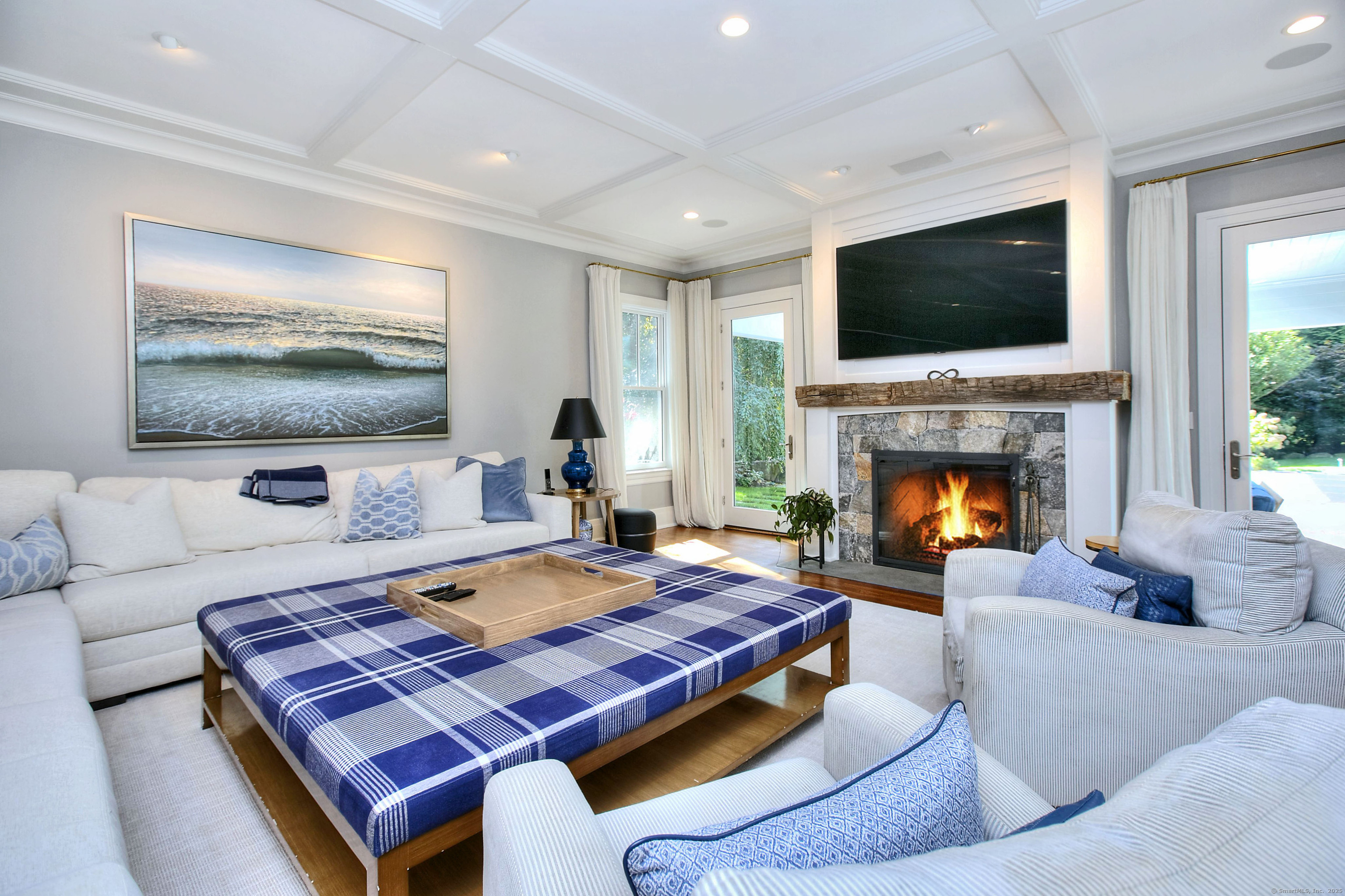 10 Debra Lane Westport, CT 06880 - Photo 15 of 40 a living room with furniture and a flat screen tv