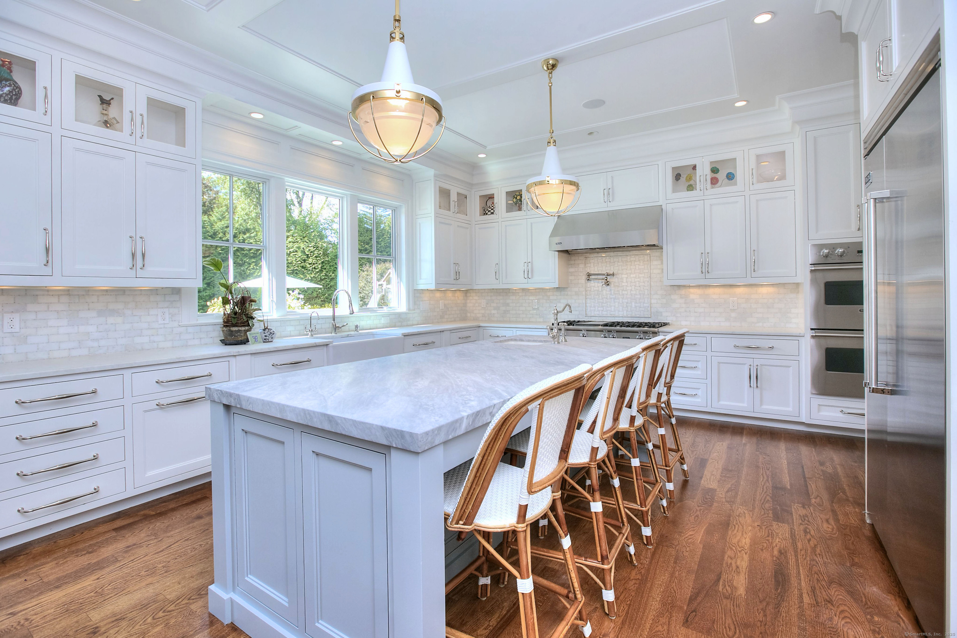 10 Debra Lane Westport, CT 06880 - Photo 20 of 40 a kitchen with stainless steel appliances granite countertop a sink a stove and a wooden floors