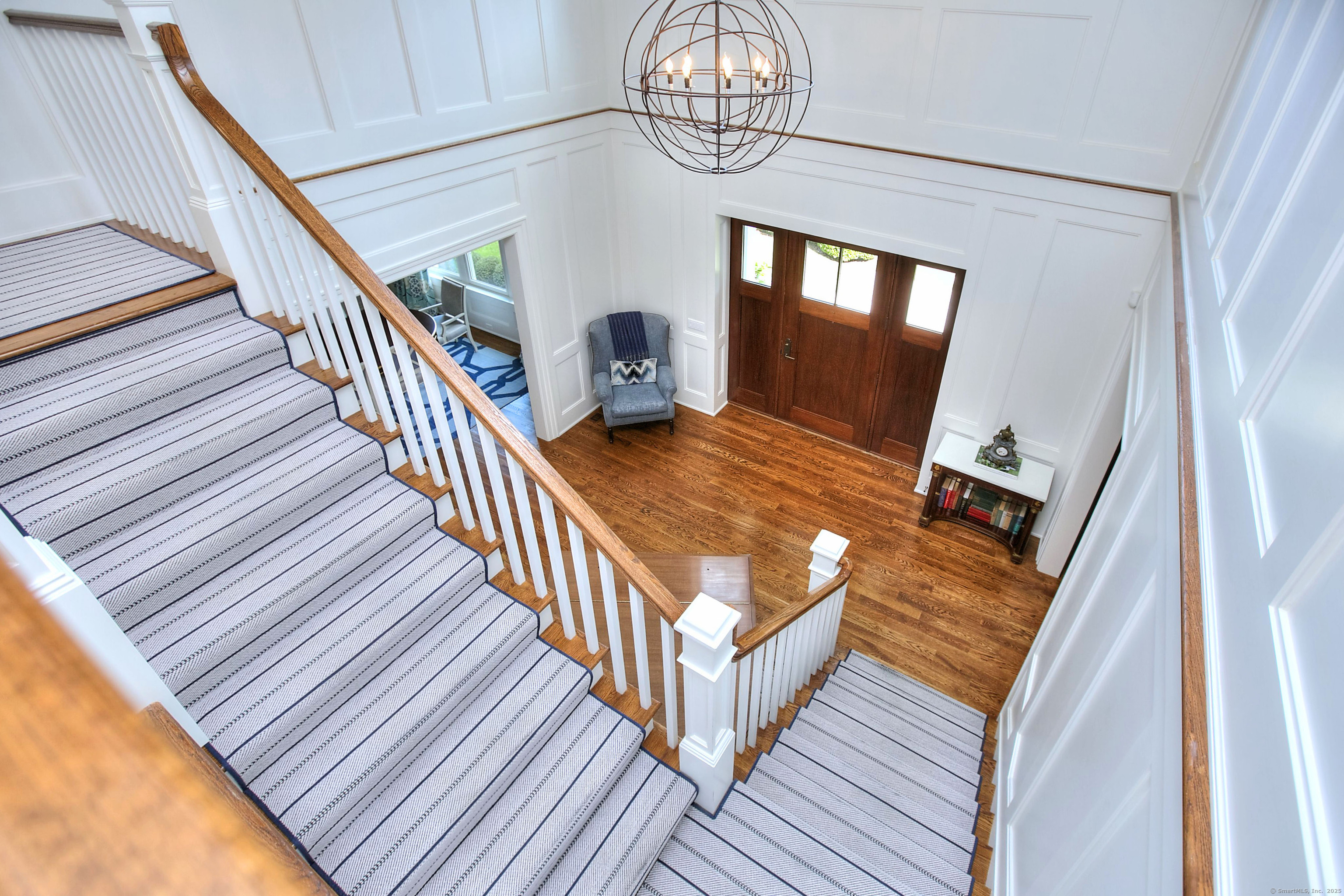 10 Debra Lane Westport, CT 06880 - Photo 27 of 40 a view of staircase with wooden floor and fan