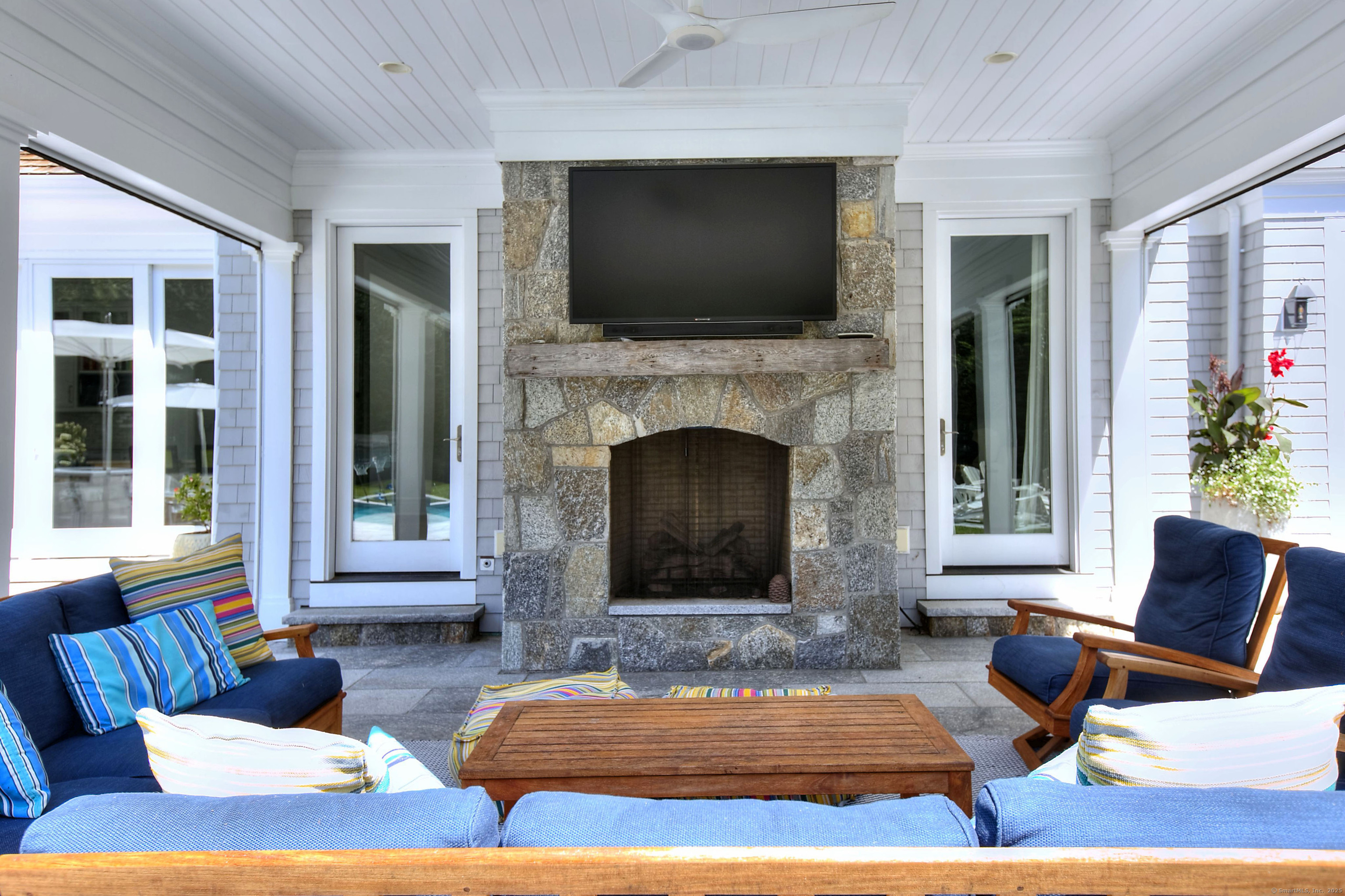 10 Debra Lane Westport, CT 06880 - Photo 8 of 40 a living room with furniture fireplace and flat screen tv