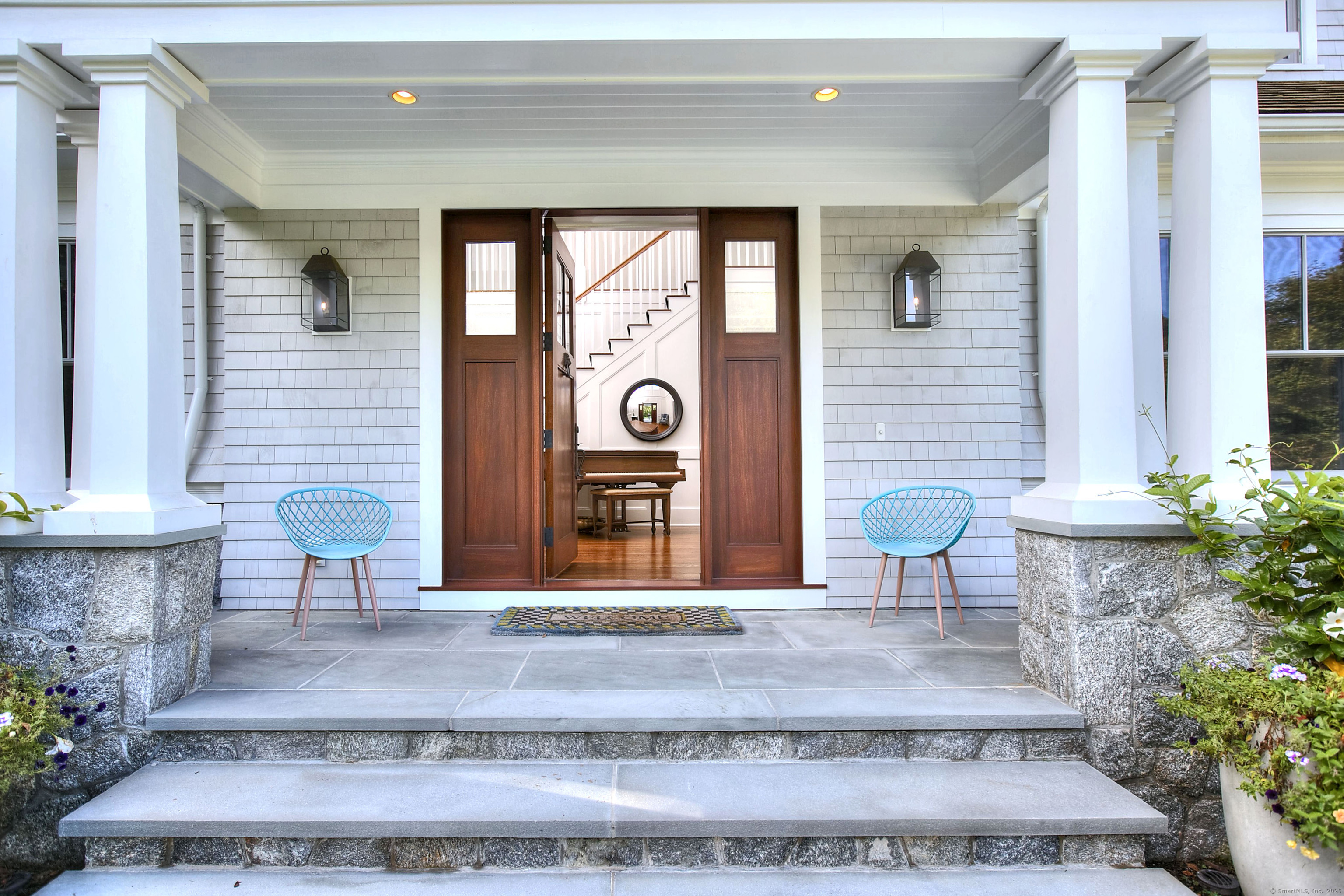 10 Debra Lane Westport, CT 06880 - Photo 9 of 40 a view of a brick house with potted plants