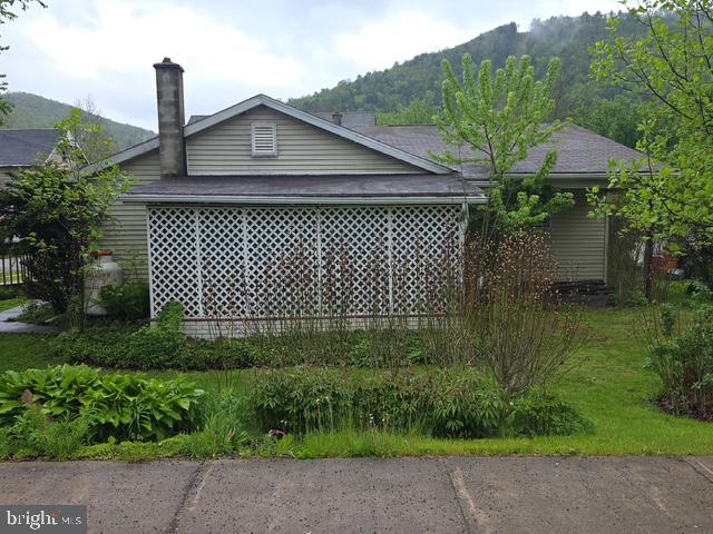 100 Mill Street Trout Run, PA 17771 - Photo 3 of 17 a front view of a house with a garden