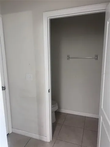 a room with a sink and cabinets