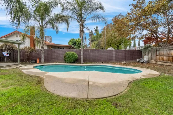 a view of a house with swimming pool