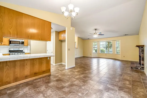 a view of a kitchen with a sink and a window