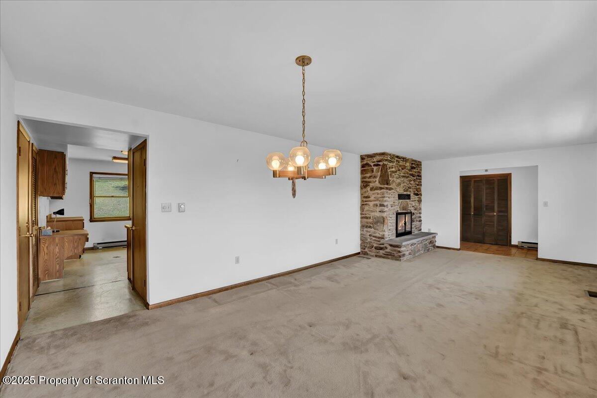906 Violet Terrace Clarks Summit, PA 18411 - Photo 13 of 38 a view of a livingroom with a chandelier