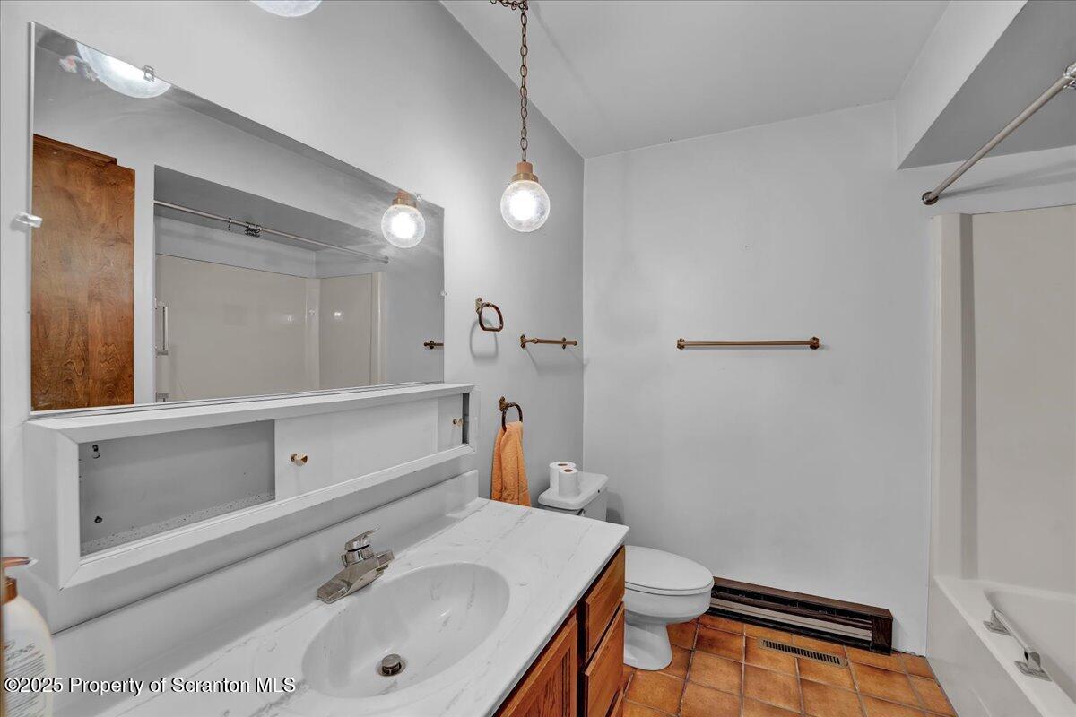 906 Violet Terrace Clarks Summit, PA 18411 - Photo 19 of 38 a bathroom with a sink and a mirror