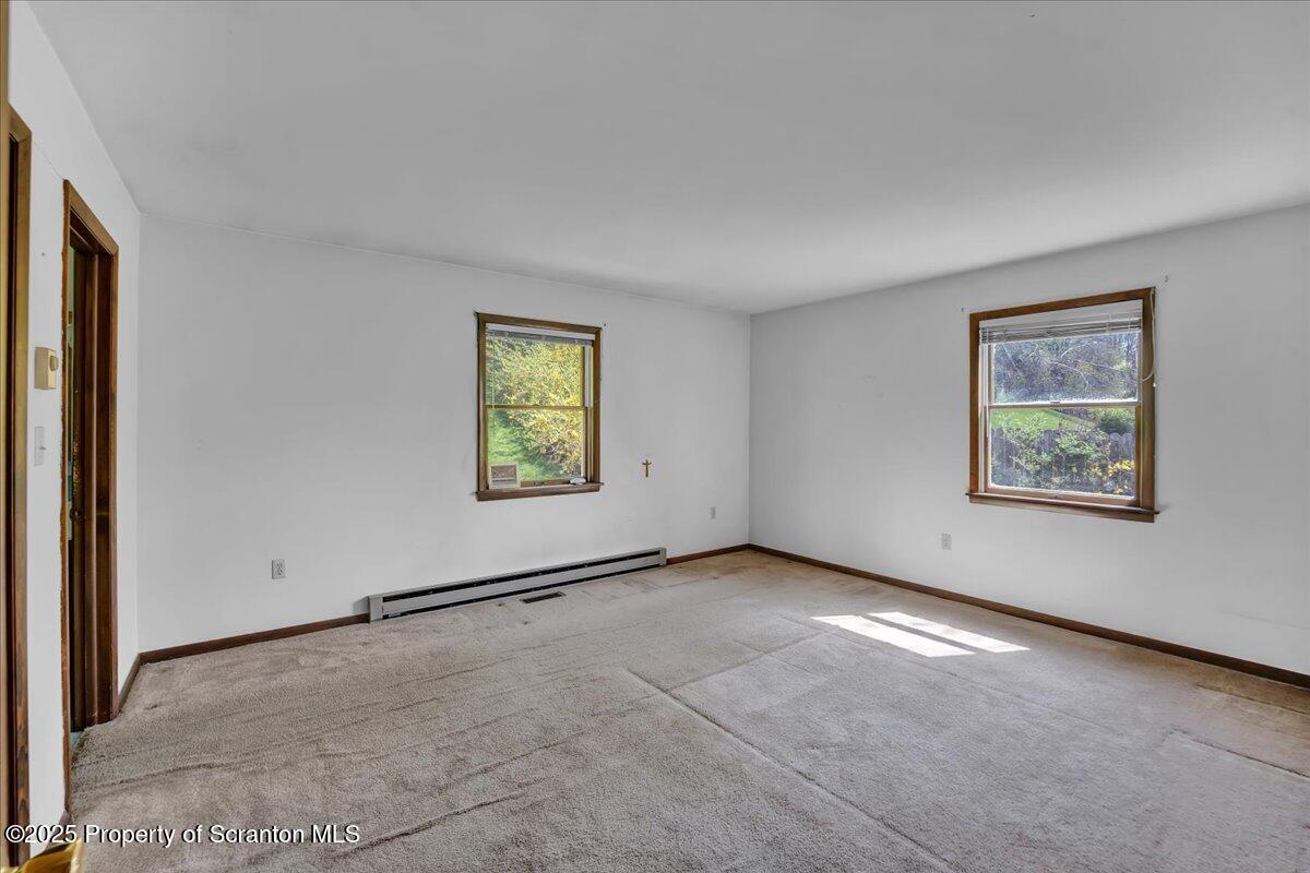 906 Violet Terrace Clarks Summit, PA 18411 - Photo 20 of 38 an empty room with windows