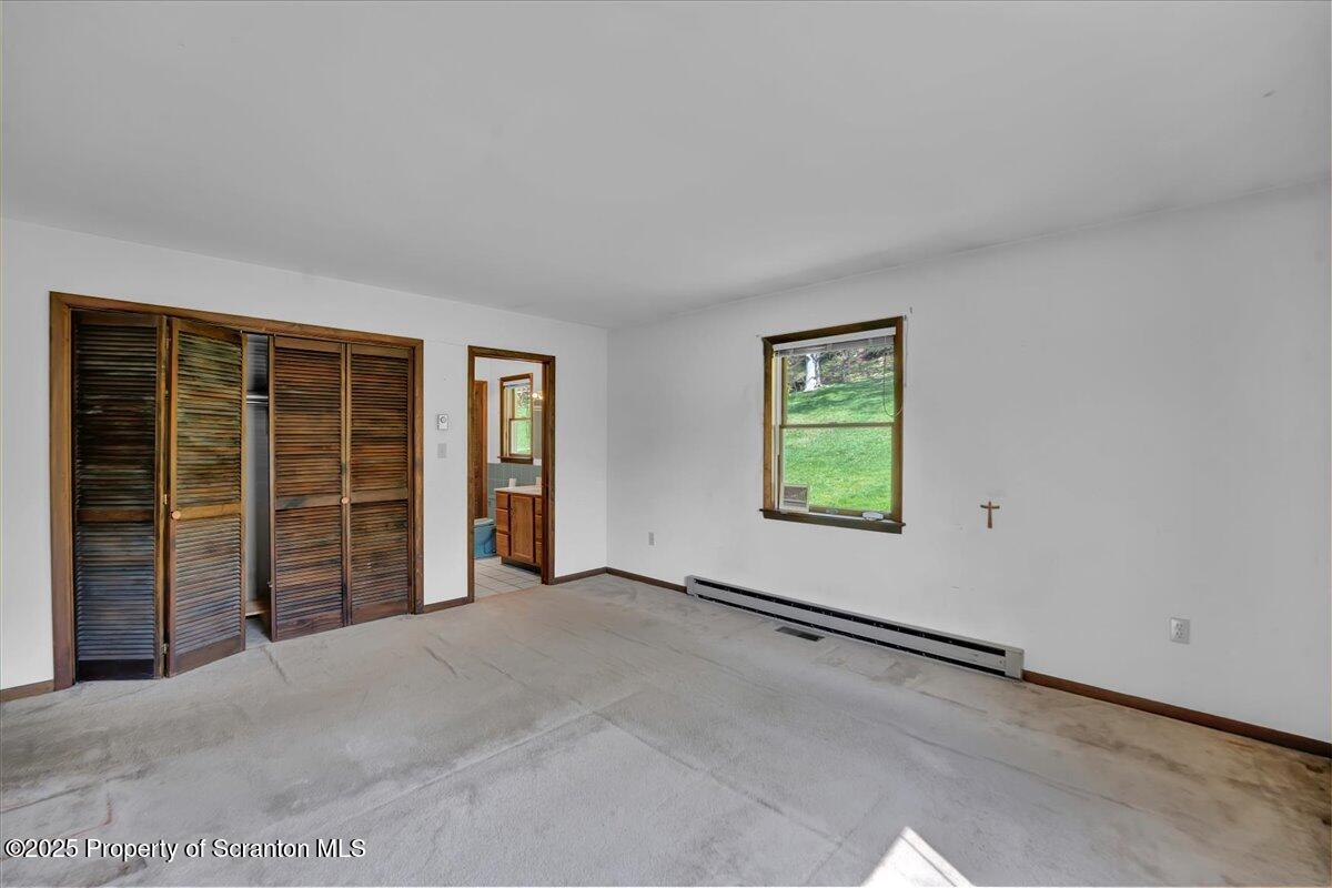 906 Violet Terrace Clarks Summit, PA 18411 - Photo 21 of 38 a view of an empty room with a window