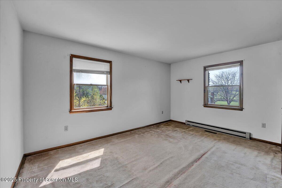 906 Violet Terrace Clarks Summit, PA 18411 - Photo 23 of 38 an empty room with windows