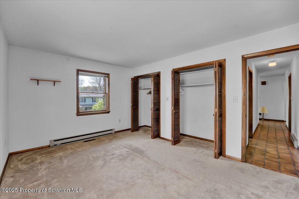 906 Violet Terrace Clarks Summit, PA 18411 - Photo 24 of 38 an empty room with windows and closet