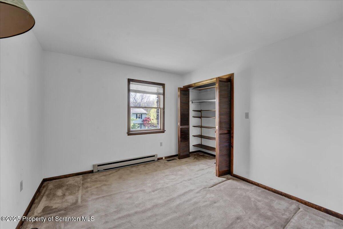 906 Violet Terrace Clarks Summit, PA 18411 - Photo 25 of 38 an empty room with windows