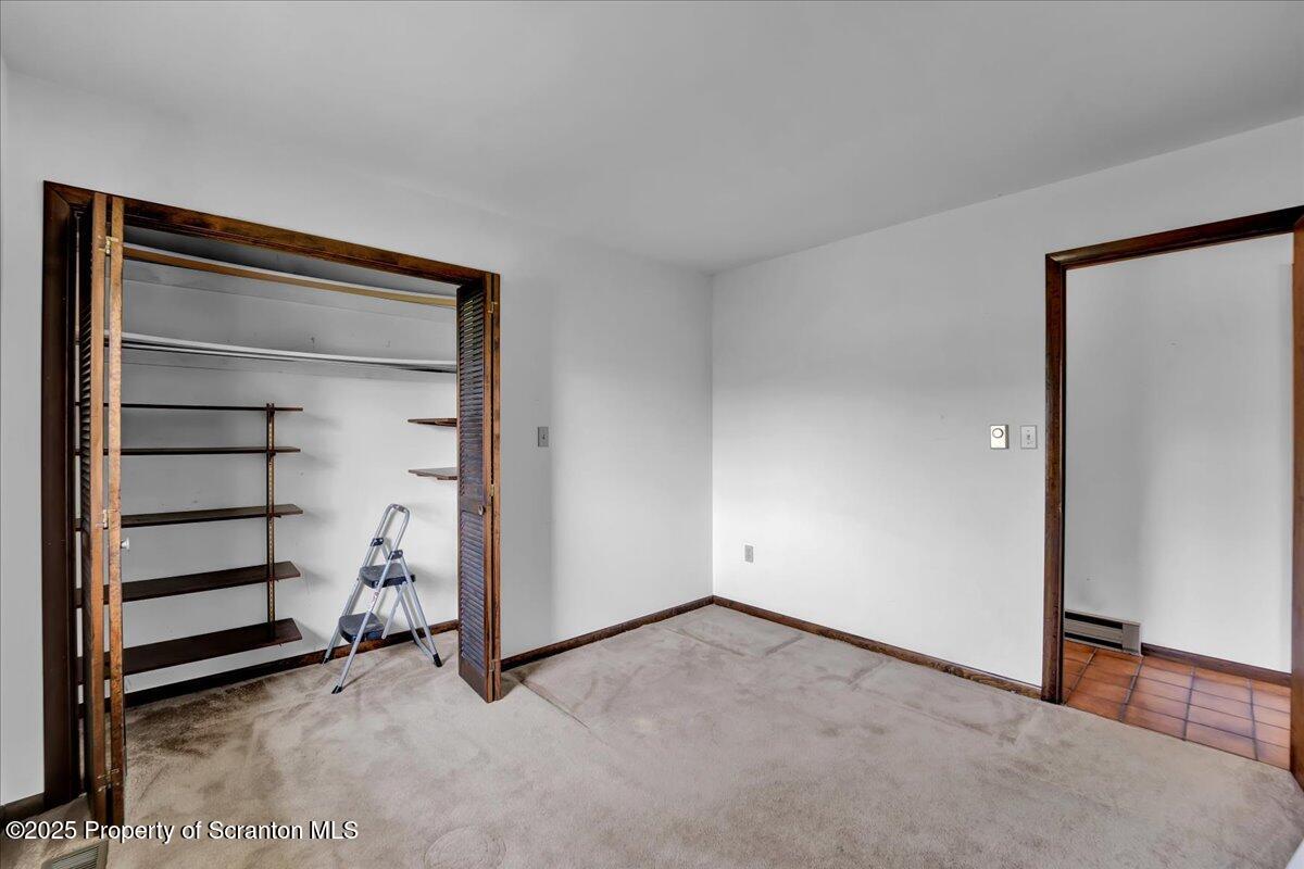 906 Violet Terrace Clarks Summit, PA 18411 - Photo 26 of 38 a view of an empty room and empty shelves