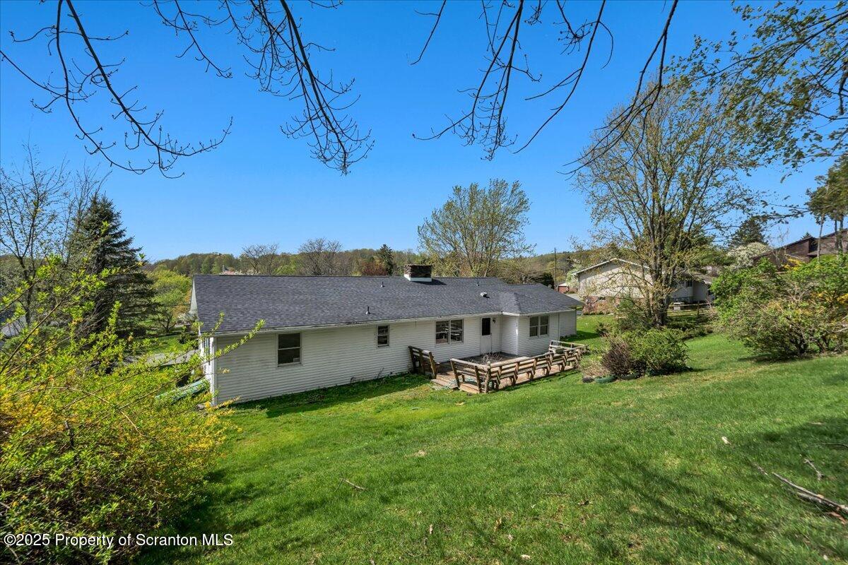 906 Violet Terrace Clarks Summit, PA 18411 - Photo 29 of 38 a view of a chair and table in backyard of the house