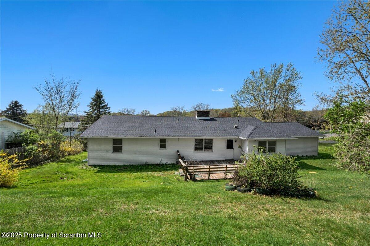 906 Violet Terrace Clarks Summit, PA 18411 - Photo 30 of 38 a front view of a house with a garden and trees