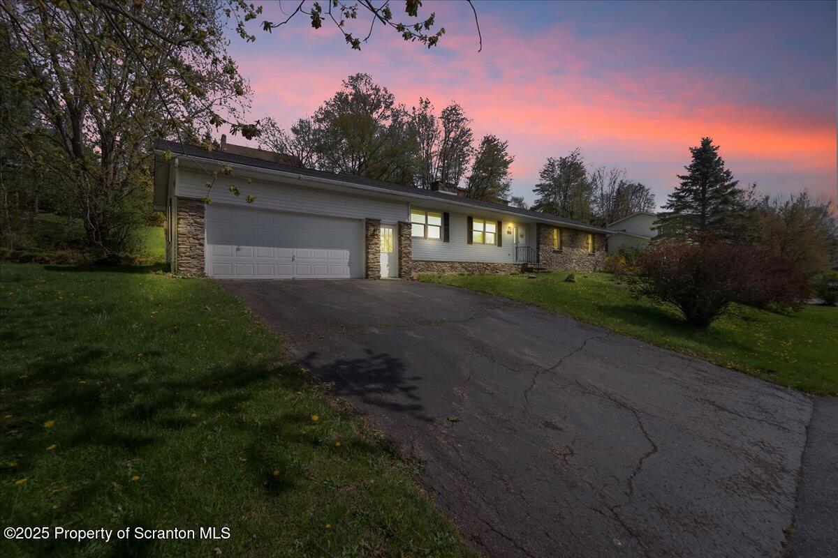 906 Violet Terrace Clarks Summit, PA 18411 - Photo 3 of 38 a front view of a house with garden