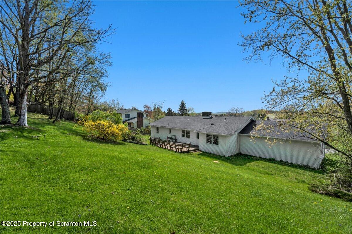 906 Violet Terrace Clarks Summit, PA 18411 - Photo 31 of 38 a view of a house with a big yard and large trees