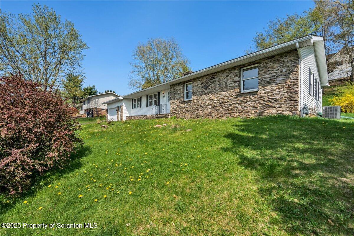 906 Violet Terrace Clarks Summit, PA 18411 - Photo 35 of 38 a front view of a house with garden