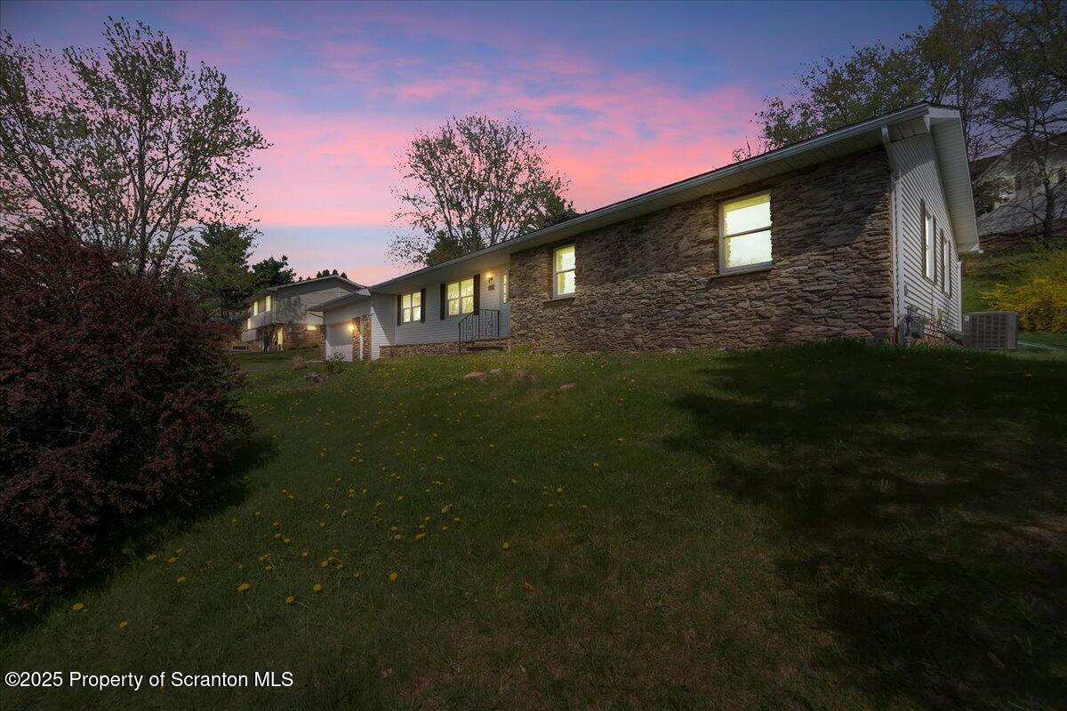 906 Violet Terrace Clarks Summit, PA 18411 - Photo 38 of 38 a front view of a house with garden