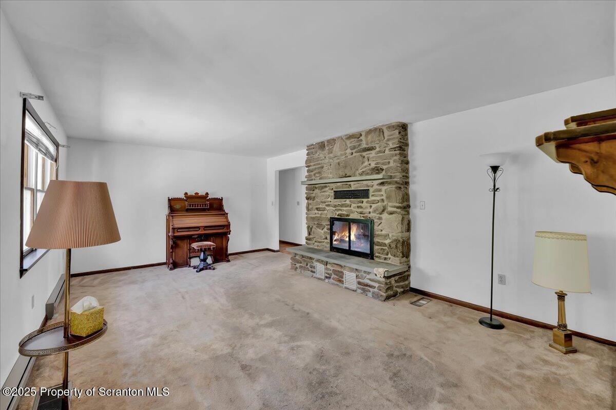 906 Violet Terrace Clarks Summit, PA 18411 - Photo 5 of 38 a view of room with furniture and a ceiling fan