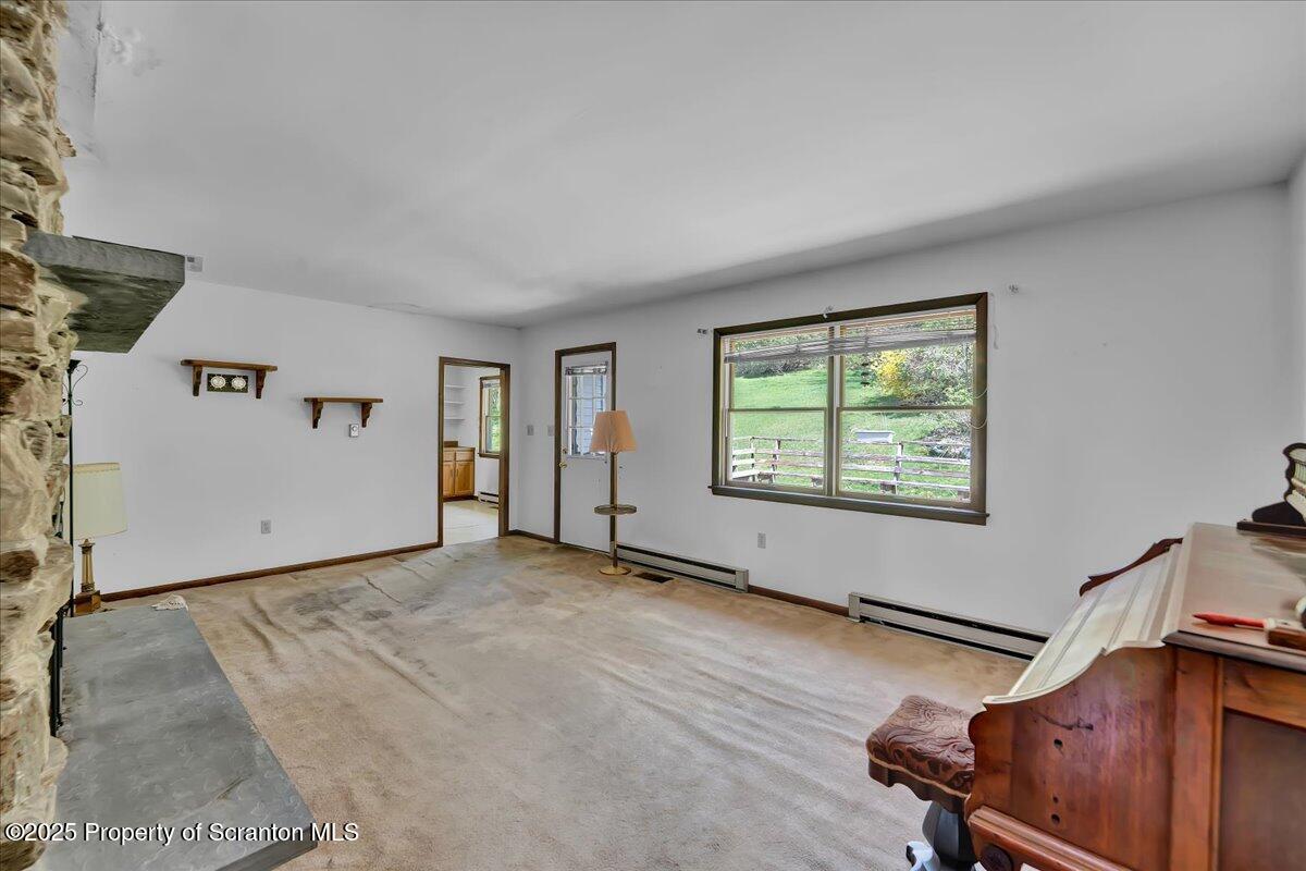 906 Violet Terrace Clarks Summit, PA 18411 - Photo 8 of 38 an empty room with windows