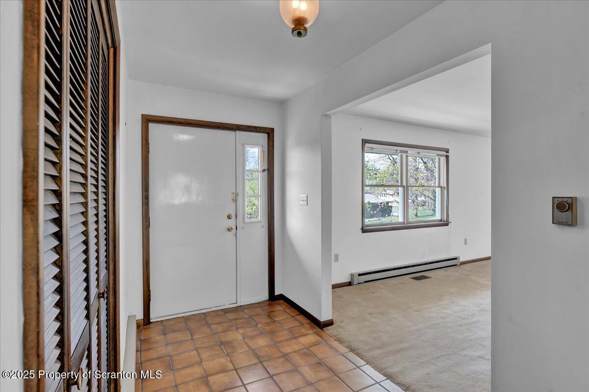906 Violet Terrace Clarks Summit, PA 18411 - Photo 9 of 38 an empty room with windows
