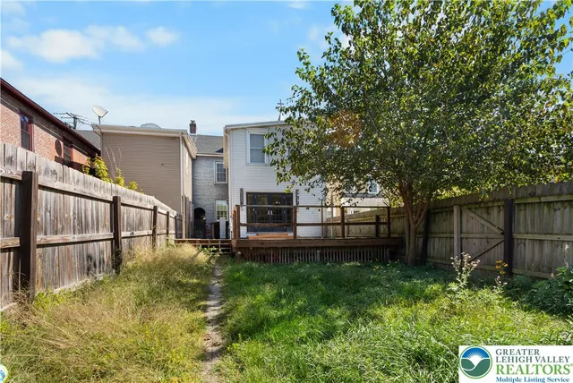 a view of a room with wooden walls
