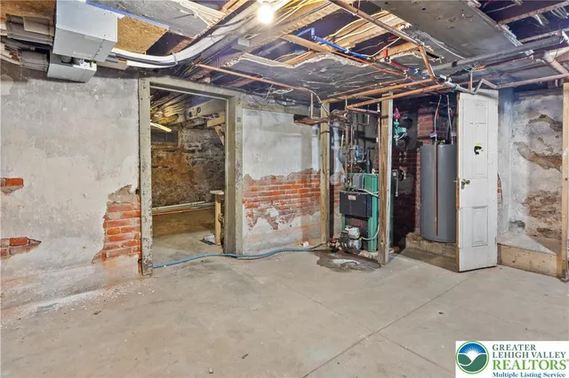 a view of a hallway with wooden floor and stairs