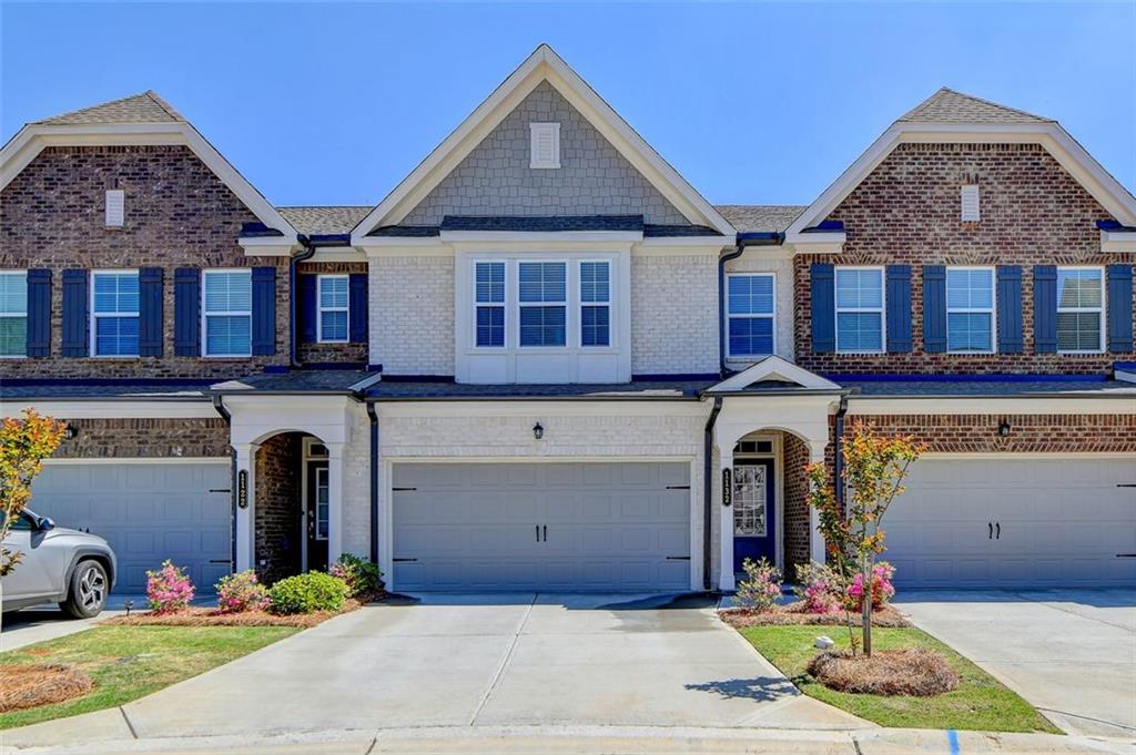 1132 Edwin Lane Sugar Hill, GA 30518 - Photo 1 of 1 a front view of a house with yard and parking